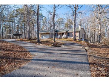 House exterior featuring a carport and long driveway at 209 Meadowridge Dr, Maiden, NC 28650