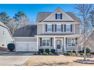 Two-story house with gray siding, dark shutters, and a two-car garage at 273 Sweet Briar Dr, Fort Mill, SC 29707