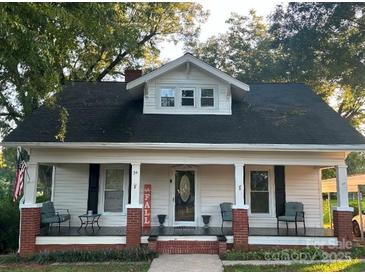 Charming single Gathering home with a covered front porch and classic architectural details at 34 Lee Rd, Stony Point, NC 28678