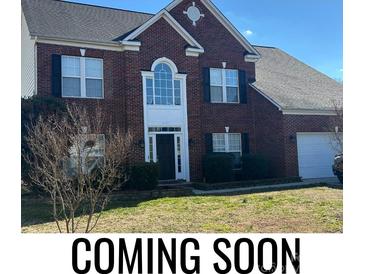 Two-story brick home with a large front yard at 5606 Ginger Ln, Indian Trail, NC 28079