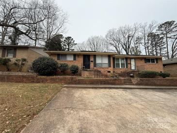 Brick ranch home with a spacious yard and parking at 4818 Highlake Dr, Charlotte, NC 28215