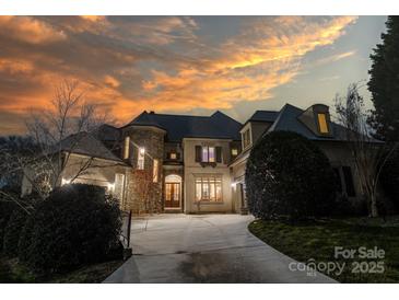 Elegant two-story home with a charming facade and landscaping at 7409 Stonecroft Park Dr, Charlotte, NC 28226