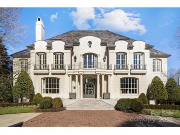 Stunning two-story brick home with a classic design and landscaped grounds at 413 Eastover Rd, Charlotte, NC 28207
