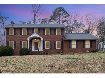 Brick house with a two-car garage and well-maintained lawn at 330 Regency Rd, Salisbury, NC 28147