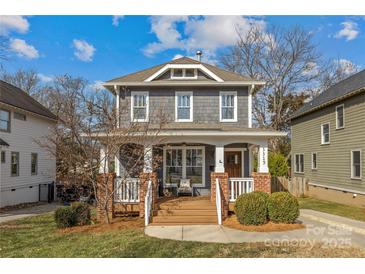 Charming craftsman home with gray siding, brick accents, and a welcoming front porch at 3319 Holt St, Charlotte, NC 28205