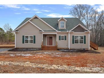 Newly constructed craftsman style home with a front porch and stone accents at 5605 Miami Ln, Concord, NC 28025