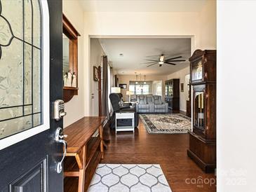 Bright and spacious entryway with hardwood floors and a view of the living room at 8024 Carolina Lakes Way, Fort Mill, SC 29707