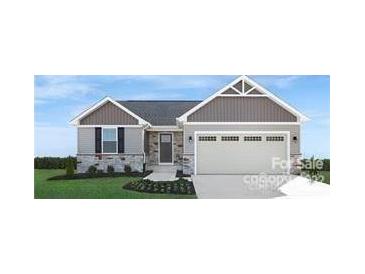 Two-story house with gray siding, stone accents, and a two-car garage at 421 Grandiflora Ave # 0084, Lancaster, SC 29720