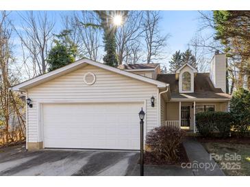 Updated two-story house with attached garage and landscaped yard at 5811 Rocky Mount Ct, Charlotte, NC 28214