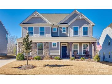 Two-story home with gray siding, stone accents, and a front porch at 6141 Russo Ct, Lancaster, SC 29720