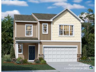 Two-story house with beige and tan siding, a two-car garage, and landscaping at 13124 Hampton Bay Ln, Charlotte, NC 28262