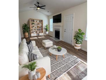 Bright living room with fireplace and stylish furniture at 1638 Hudson Graham Ln, Charlotte, NC 28216