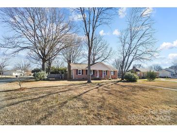 Ranch house with a large front yard and mature trees at 2203 O'Hara Dr, Charlotte, NC 28273