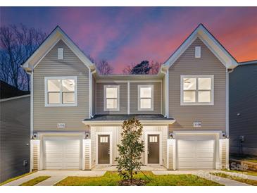 Two-story townhouses with attached garages and modern design at 3108 Amay James Ave, Charlotte, NC 28208