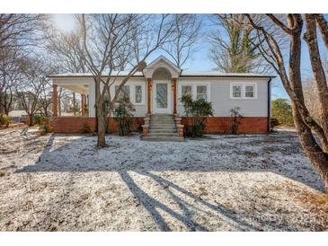 Updated craftsman home with brick accents and a covered porch at 400 E 27Th St, Kannapolis, NC 28083