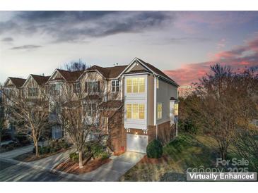 Attractive 3-story townhome with 2-car garage, nicely landscaped at 804 Skybrook Falls Dr, Huntersville, NC 28078