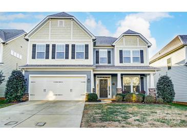 Two-story home with gray siding, white accents, and a two-car garage at 1026 Slew O Gold Ln, Indian Trail, NC 28079