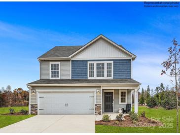 Two-story home with gray and blue siding, two-car garage, and landscaping at 117 Mountain Bridge Way, Statesville, NC 28625