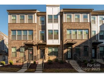 Three-story brick townhouses with modern design and landscaping at 1326 Gleason Way, Charlotte, NC 28217