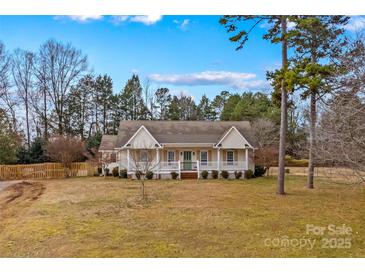 Charming one-story home with a front porch and landscaped yard at 160 Pampas Ln, Mooresville, NC 28117