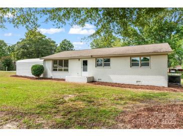 Newly renovated ranch home with a spacious front yard at 2697 Knotty Pine Dr, Lancaster, SC 29720