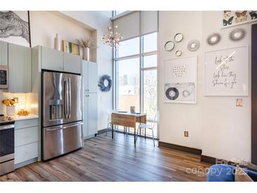 Modern kitchen with stainless steel appliances and light blue cabinetry at 300 Magnolia Ave # 301, Charlotte, NC 28203