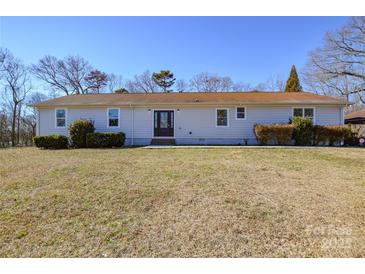 Newly renovated ranch home with a large front yard at 6615 Love Mill Rd, Monroe, NC 28110