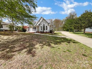 Ranch home with landscaped yard and long driveway at 918 Clover Park Dr, Clover, SC 29710