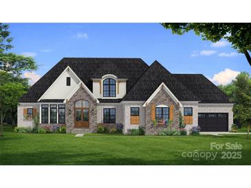 Craftsman style home with stone accents, a 3-car garage, and a landscaped lawn at 502 Sugar Maple Ln, Weddington, NC 28104