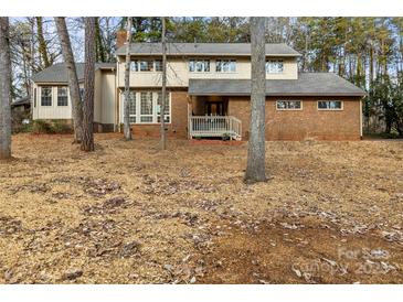 Two-story brick house with wood siding and a large deck at 69 Honeysuckle Woods, Clover, SC 29710