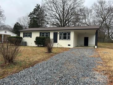 Charming ranch home with updated exterior and gravel driveway at 2334 Woodleaf Dr, Gastonia, NC 28052