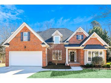 Brick home with a two-car garage and landscaping at 2608 Golden Bell Dr, Gastonia, NC 28056