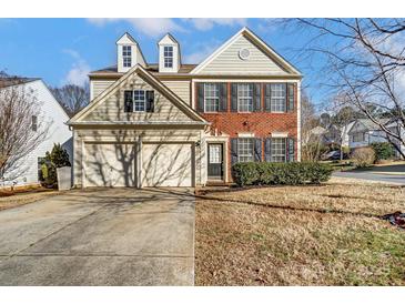 Two-story home with brick and siding exterior, two car garage at 15011 Edindale Dr, Charlotte, NC 28277