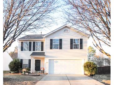 Two-story house with a white exterior, black shutters, and a two-car garage at 1866 Baylor Dr, Rock Hill, SC 29732