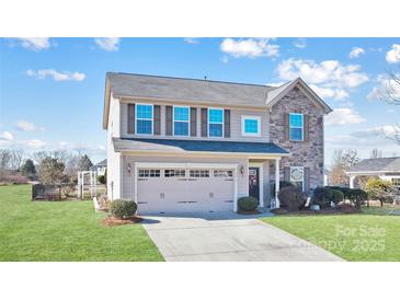 Two-story house with stone accents and a two-car garage at 2012 Orby Ave, Indian Trail, NC 28079