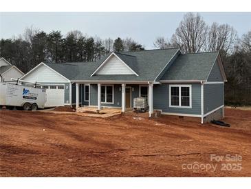 Newly constructed home featuring gray siding, a gray roof, and a covered porch at 2584 Maiden Salem Rd, Maiden, NC 28650