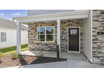 Two-story house with stone accents and a covered porch at 4618 Harris Elliot Rd, Lincolnton, NC 28092