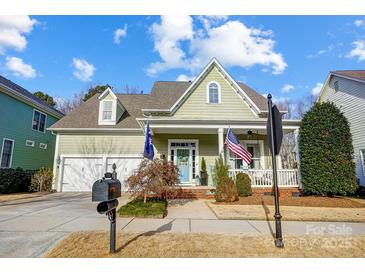 Beautiful two-story home with a charming front porch and landscaped yard at 134 Mills Ln, Fort Mill, SC 29708