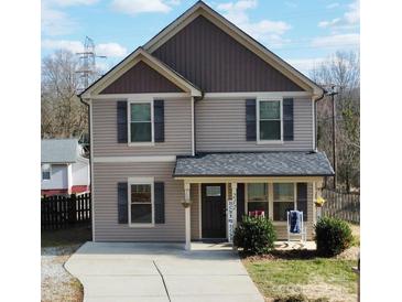 Two-story house with gray siding, dark brown accents, and a front porch at 212 Old Centergrove Rd # 111, Kannapolis, NC 28083
