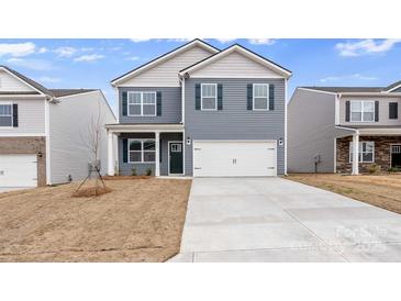 Two-story house with gray siding, white garage door, and landscaping at 4622 Harris Elliot Rd, Lincolnton, NC 28092
