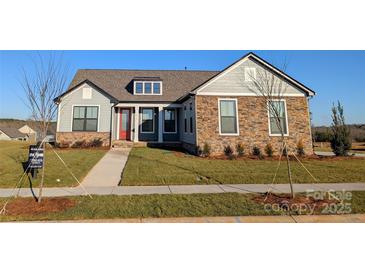 One-story home with stone and siding accents, red door, and landscaped yard at 1846 Yardley St, Rock Hill, SC 29732