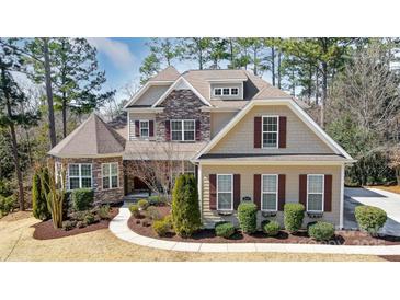 Two-story house with stone accents and a landscaped yard at 217 Ridge Reserve Dr, Lake Wylie, SC 29710