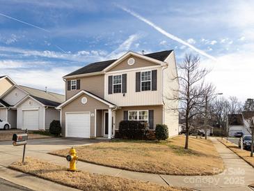 Two-story house with a neutral color scheme and a front yard at 4529 Esmeralda Dr, Charlotte, NC 28269