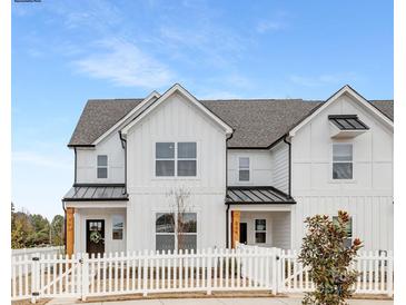 White farmhouse-style townhome with a white picket fence at 478 Berryman Rd, Rock Hill, SC 29732