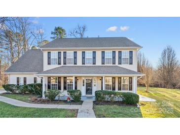 Two-story house with front porch and landscaping at 507 Bearbrook Ln, Gastonia, NC 28052