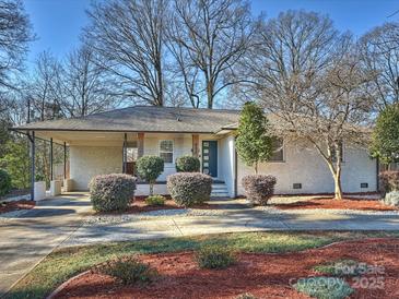 Charming ranch home with a covered porch and well-manicured landscaping at 532 Scaleybark Rd, Charlotte, NC 28209