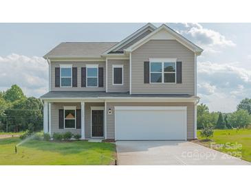Two-story house with gray siding, a white garage door, and a landscaped lawn at 2230 Catawba Trace Dr, Catawba, NC 28609