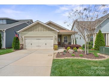 Charming single-story home featuring a well-manicured lawn, tasteful landscaping, and an attached two-car garage at 6289 Raven Rock Dr, Denver, NC 28037