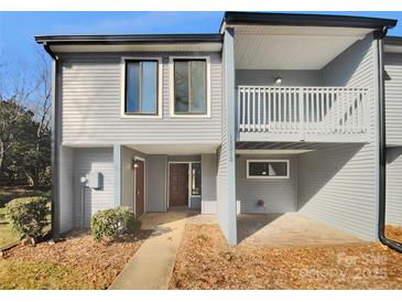 Updated townhome exterior boasts new siding and landscaping at 11212 Carmel Chace Dr # 101, Charlotte, NC 28226