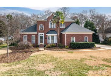 Charming two-story brick home with landscaped front yard and mature tree at 133 Castaway Trl, Mooresville, NC 28117